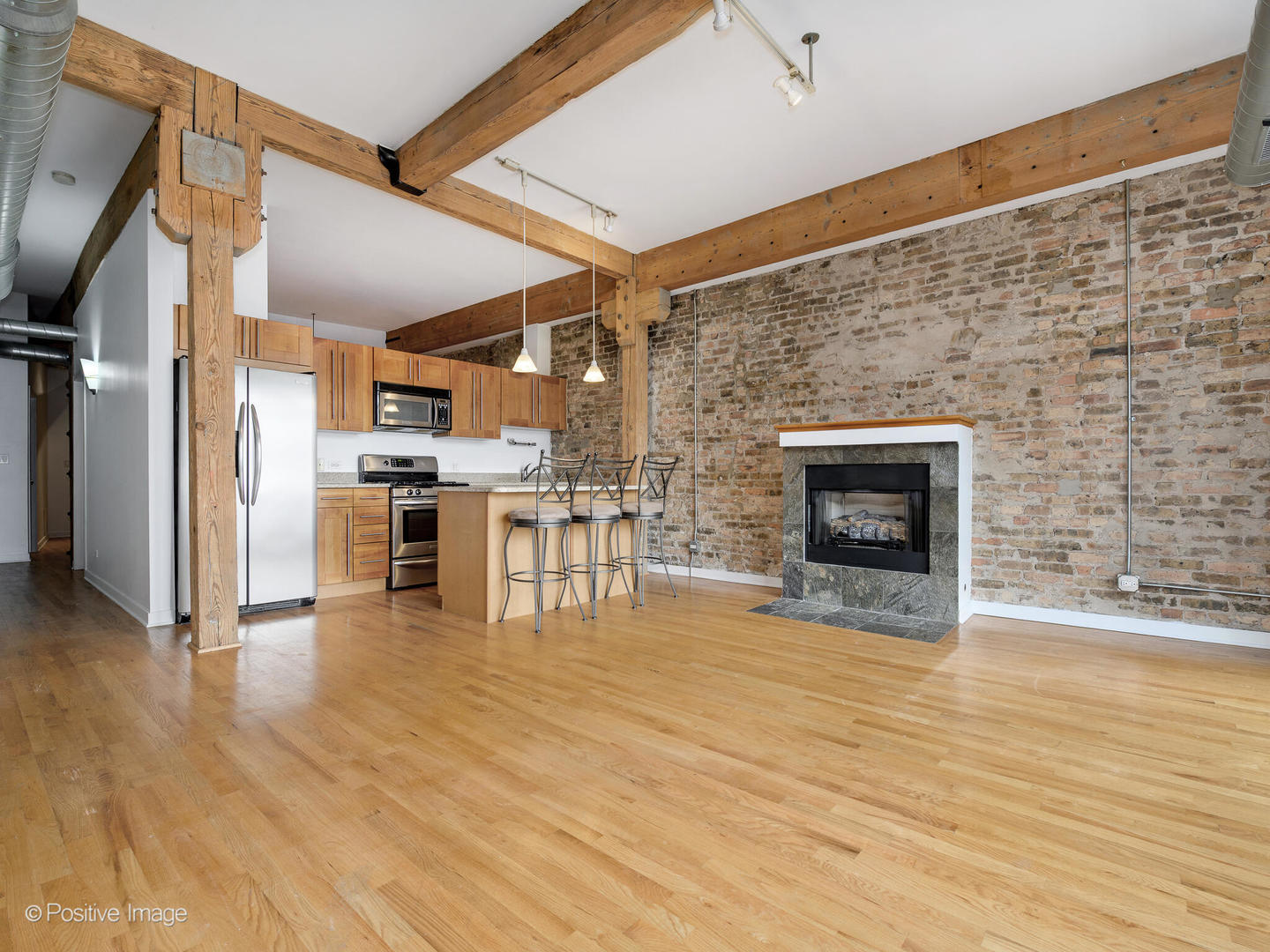 1344 West Madison Street, Unit 301 Chicago, IL 60607 - Photo 5 of 13 a view of kitchen with furniture and wooden floor