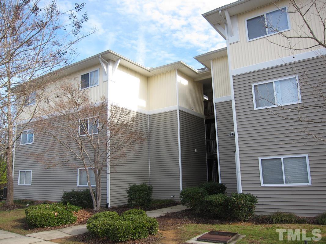 303 Smith Level Road, Unit F11 Chapel Hill, NC 27516 - Photo 13 of 14 a view of a house with a yard