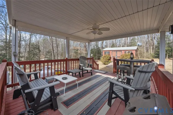 a view of a house with wooden deck