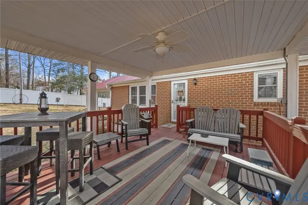 a view of a house with a yard and sitting area
