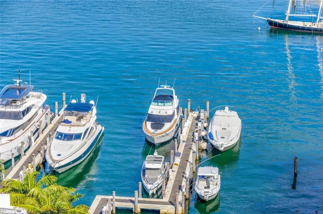 a view of a wooden floor and chairs in the patio