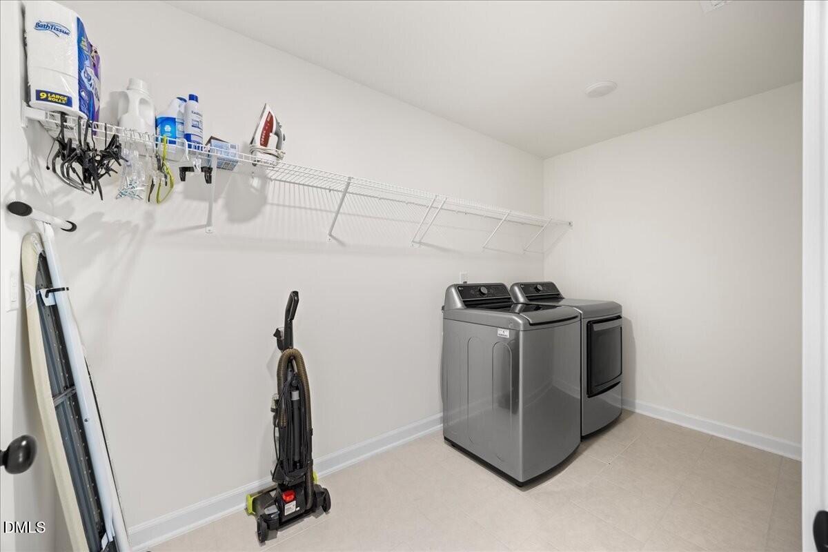 653 Craftsman Rdg Trail Knightdale, NC 27545 - Photo 37 of 50 a utility room with dryer and washer