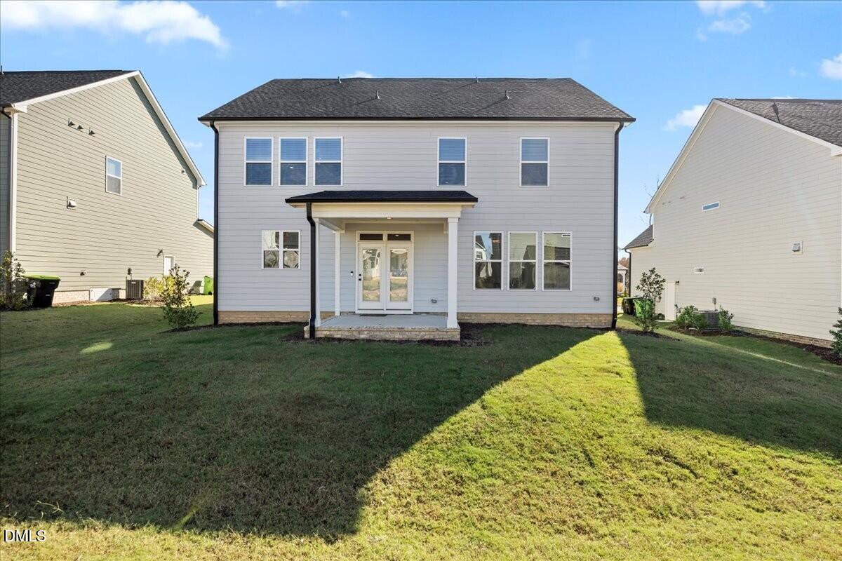 653 Craftsman Rdg Trail Knightdale, NC 27545 - Photo 44 of 50 a front view of a house with a yard