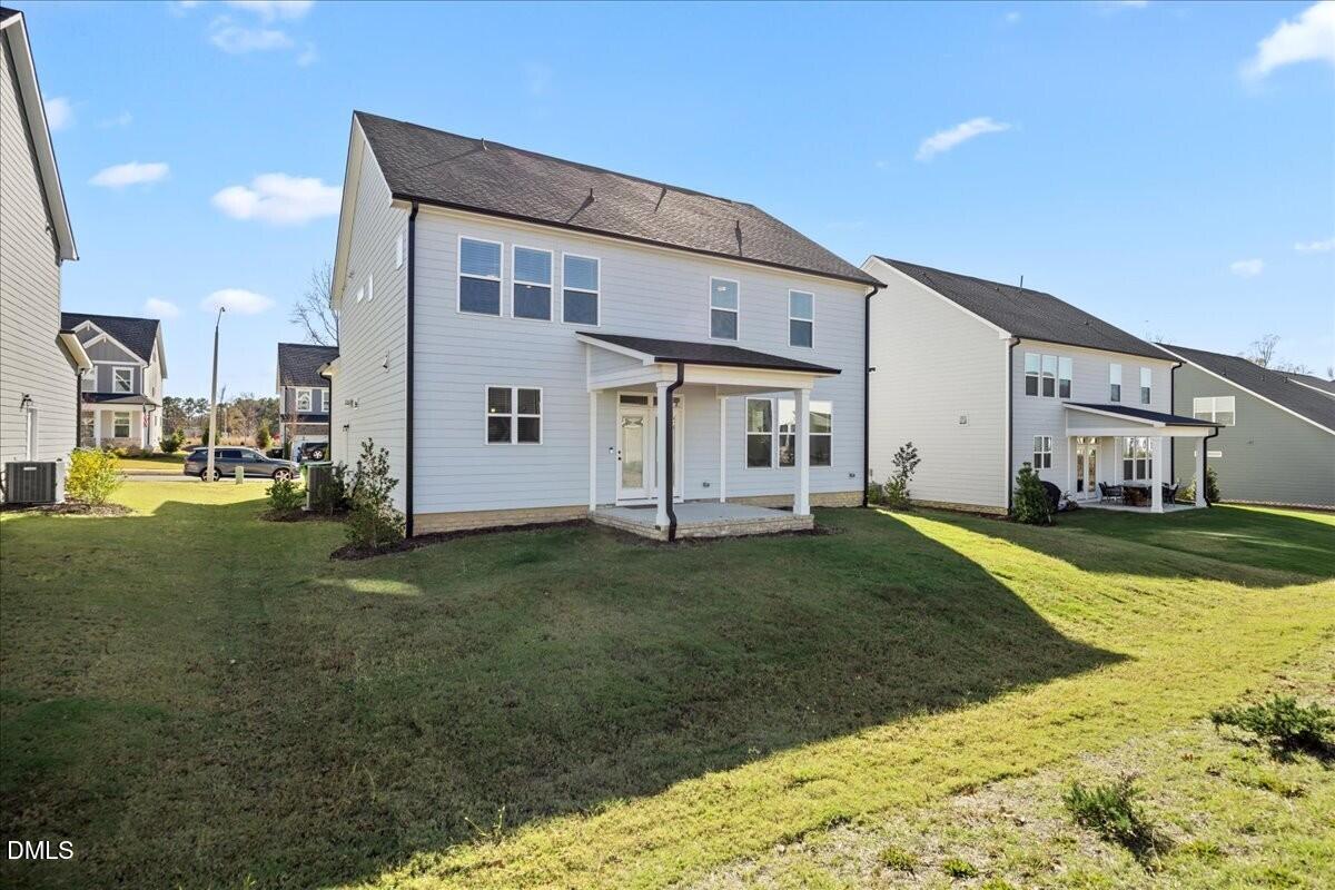653 Craftsman Rdg Trail Knightdale, NC 27545 - Photo 45 of 50 a view of a house with a yard