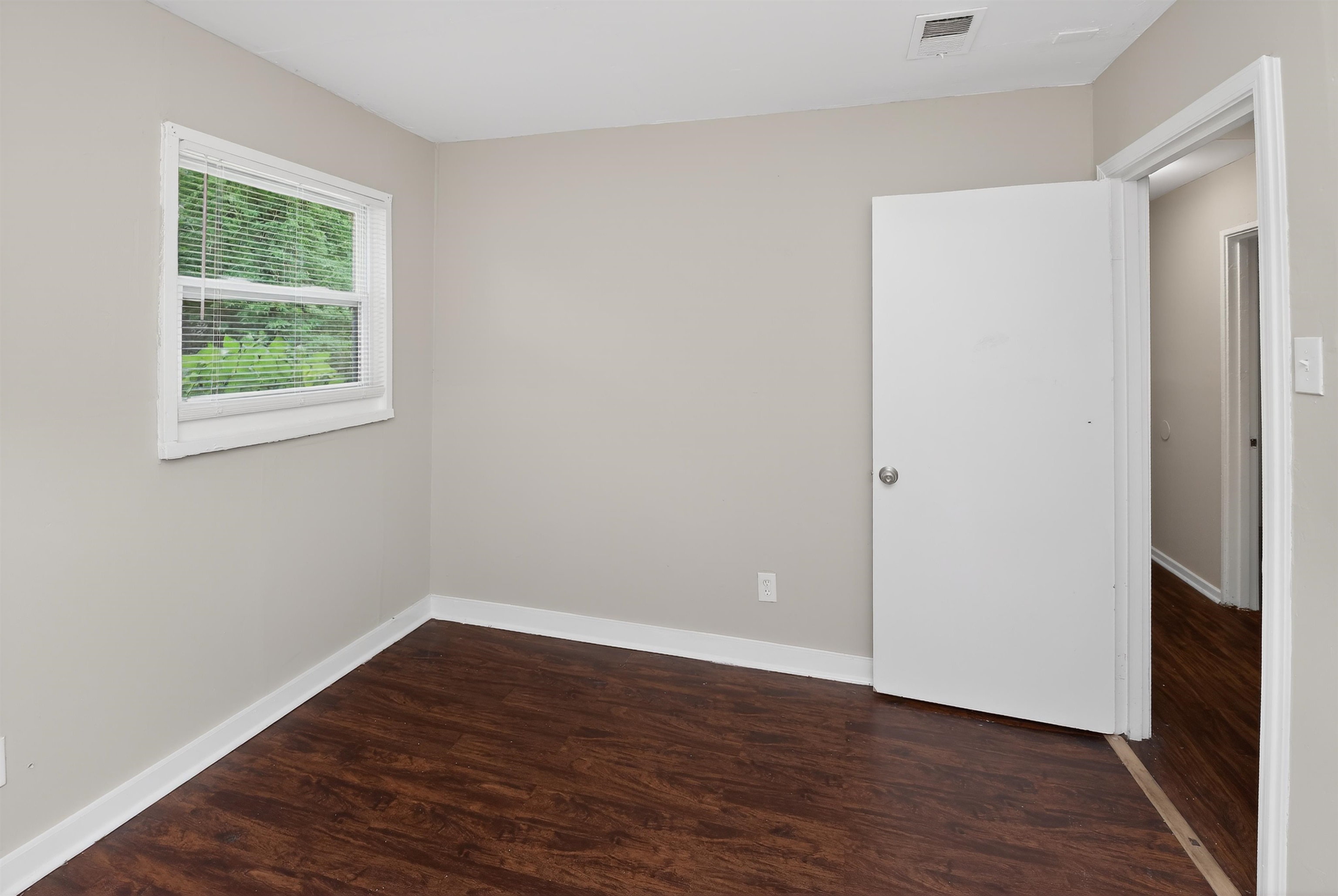 4838 Manson Road Memphis, TN 38109 - Photo 14 of 28 Bedroom with wood-finish flooring and light gray wall paint