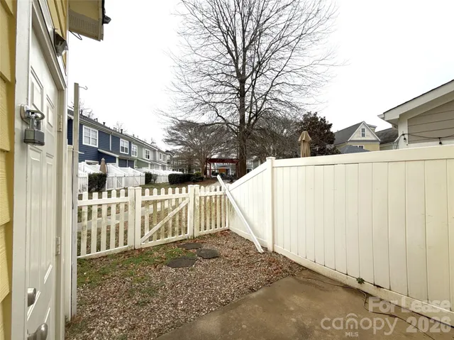 a view of a wooden fence next to a building