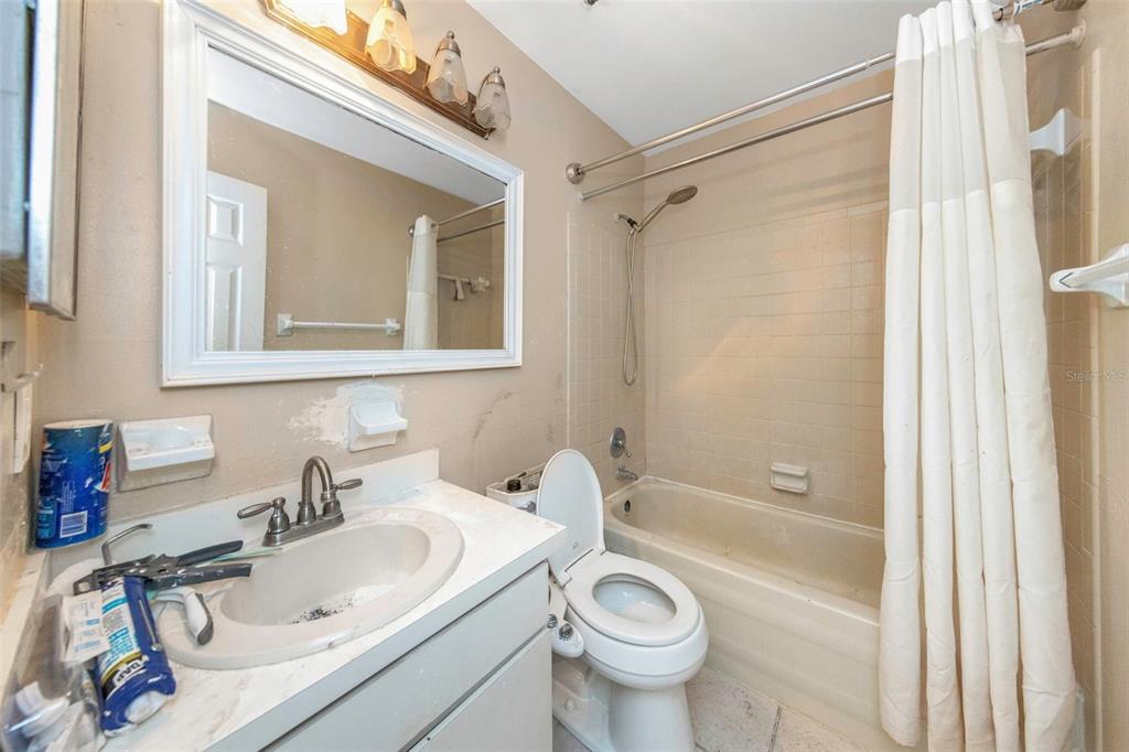 17704 Rivendel Road Lutz, FL 33549 - Photo 12 of 21 a bathroom with a sink toilet and shower