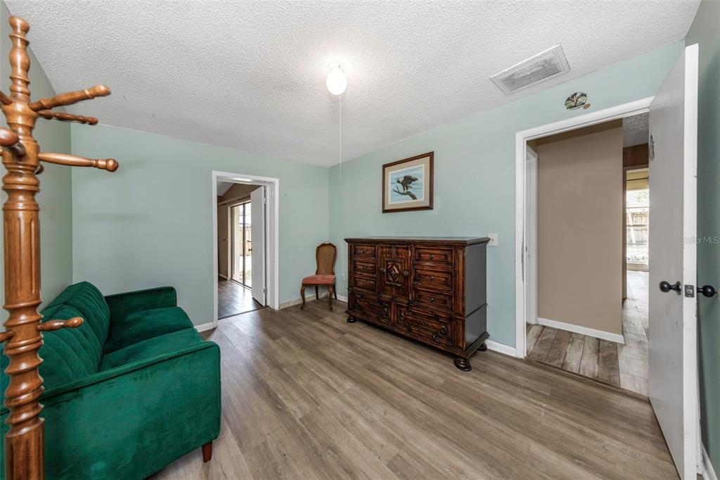 17704 Rivendel Road Lutz, FL 33549 - Photo 18 of 21 a living room with furniture and a flat screen tv