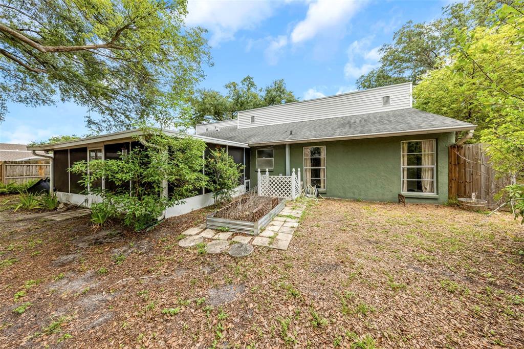 17704 Rivendel Road Lutz, FL 33549 - Photo 20 of 21 a view of a house with a yard and potted plants