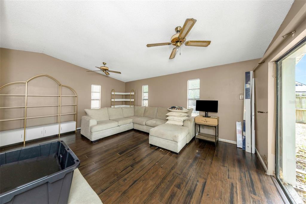 17704 Rivendel Road Lutz, FL 33549 - Photo 10 of 21 a living room with furniture and a large window