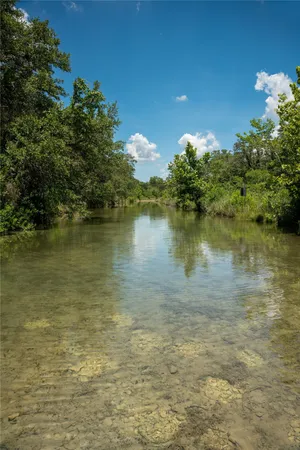a view of a lake and sunset