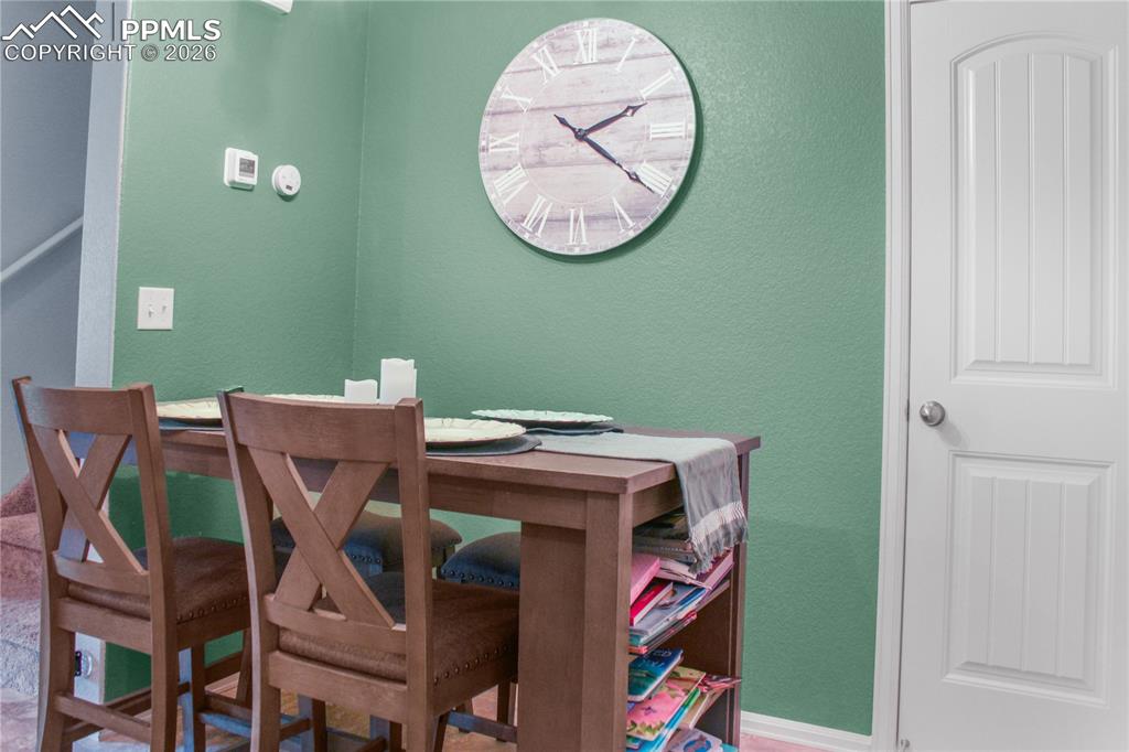 7649 Grand Fir Point Colorado Springs, CO 80908 - Photo 8 of 19 a view of a dining room with furniture