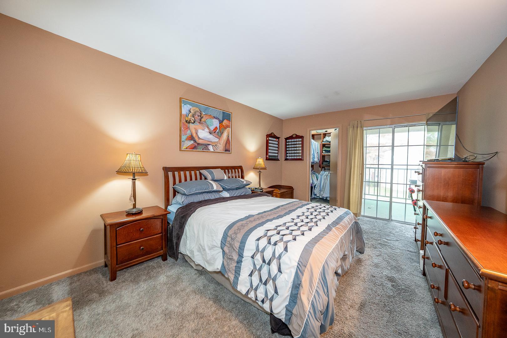 108 Valley Stream Circle, Unit 108A Chesterbrook, PA 19087 - Photo 12 of 22 a bed room with a bed and a night stand