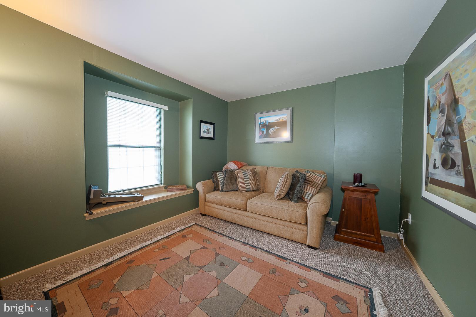 108 Valley Stream Circle, Unit 108A Chesterbrook, PA 19087 - Photo 17 of 22 a living room with furniture and a window