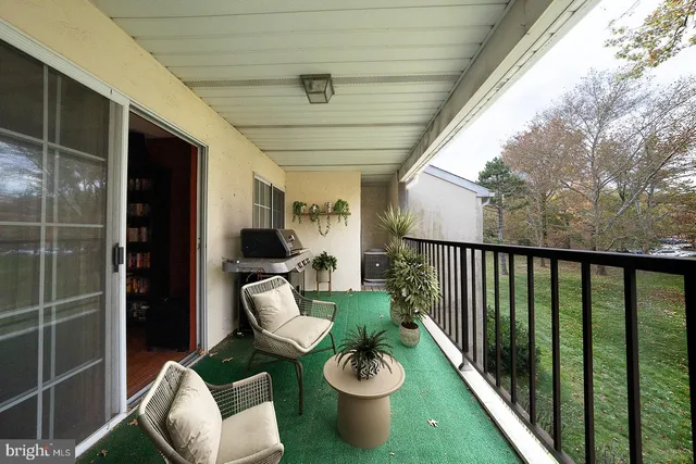 a view of a porch with furniture