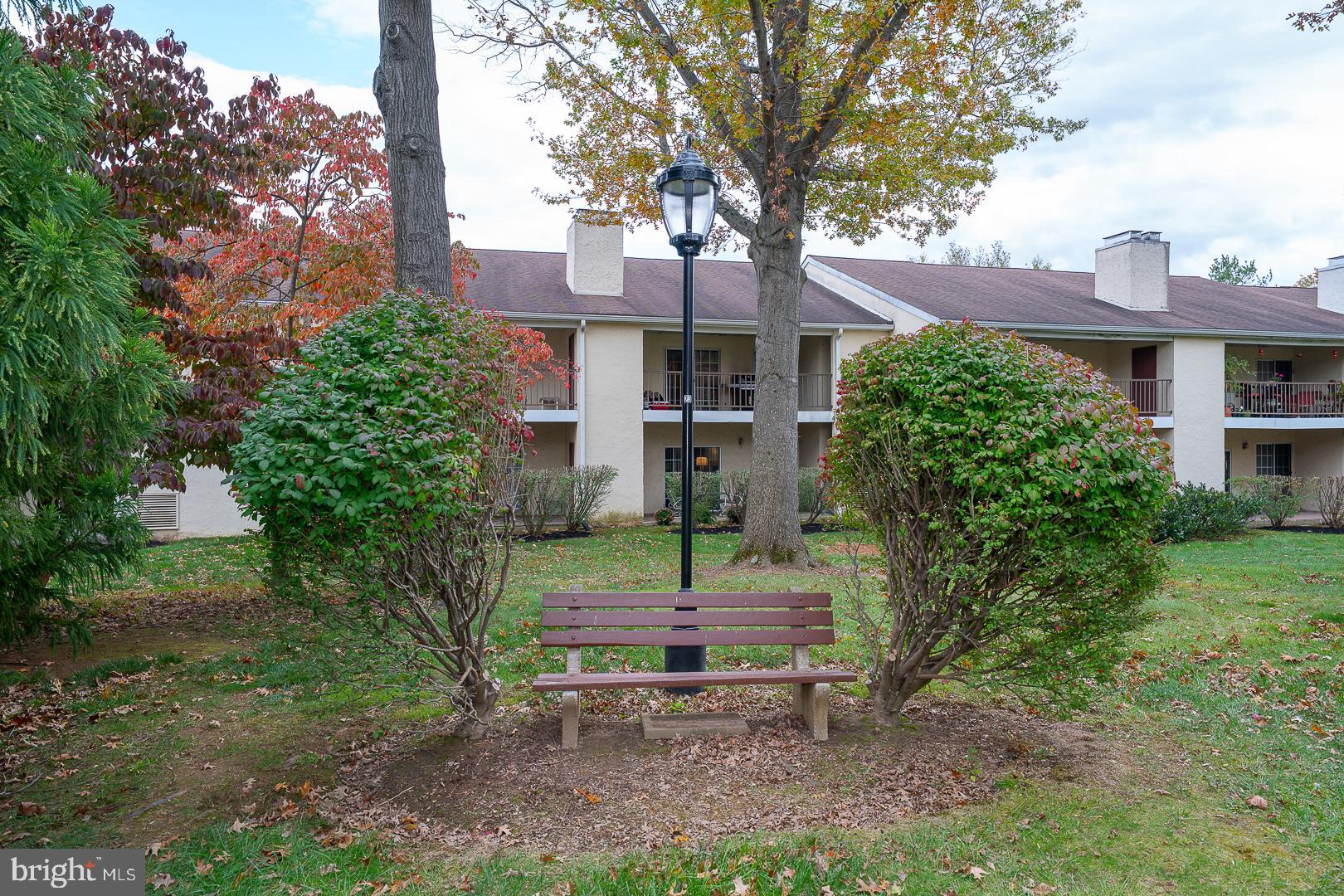 108 Valley Stream Circle, Unit 108A Chesterbrook, PA 19087 - Photo 20 of 22 a small garden in the middle of a yard