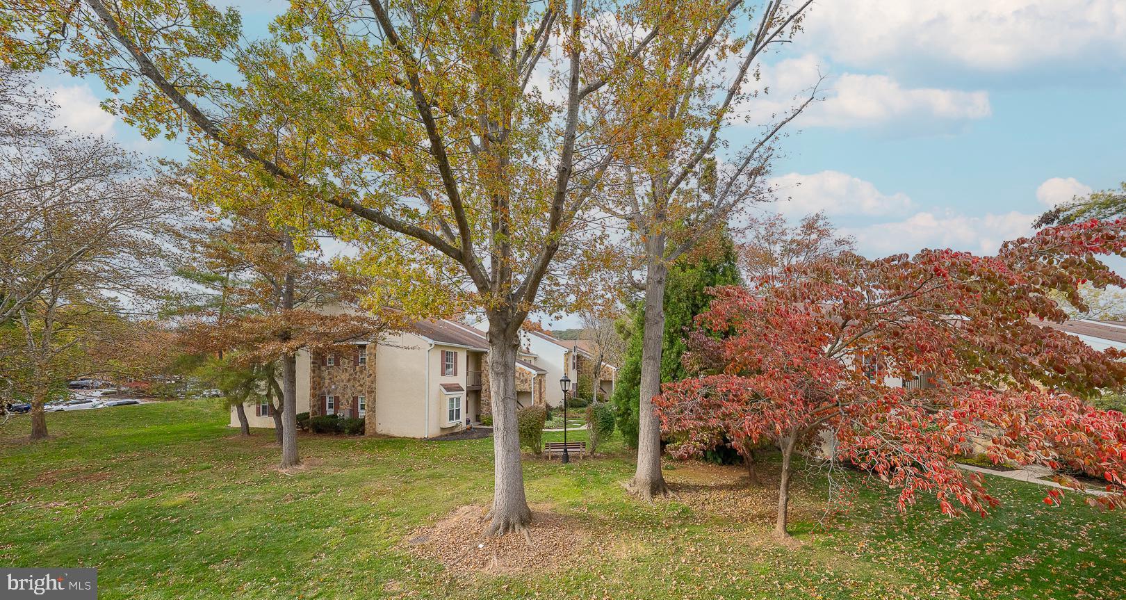 108 Valley Stream Circle, Unit 108A Chesterbrook, PA 19087 - Photo 21 of 22 a house with trees in front of it