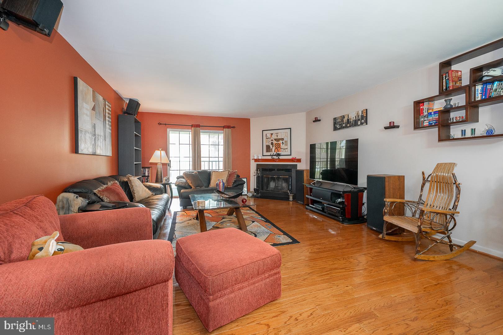 108 Valley Stream Circle, Unit 108A Chesterbrook, PA 19087 - Photo 3 of 22 a living room with furniture a flat screen tv and a window