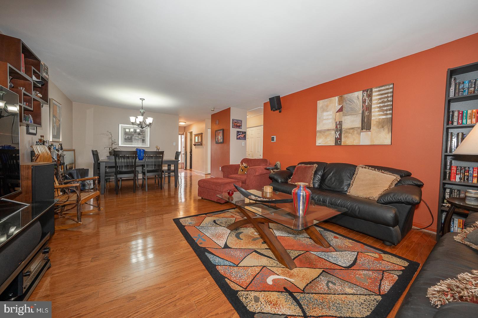 108 Valley Stream Circle, Unit 108A Chesterbrook, PA 19087 - Photo 5 of 22 a living room with furniture a wooden floor and next to a window