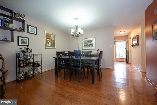 a view of a dining room with furniture and chandelier