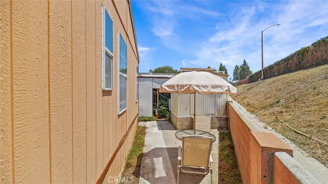 a view of balcony with furniture