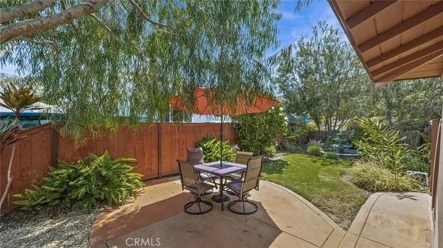a table and chairs in a garden