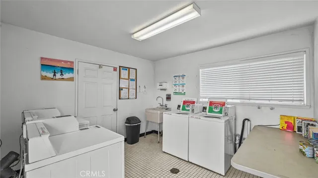 a view of a house with swimming pool and sitting area