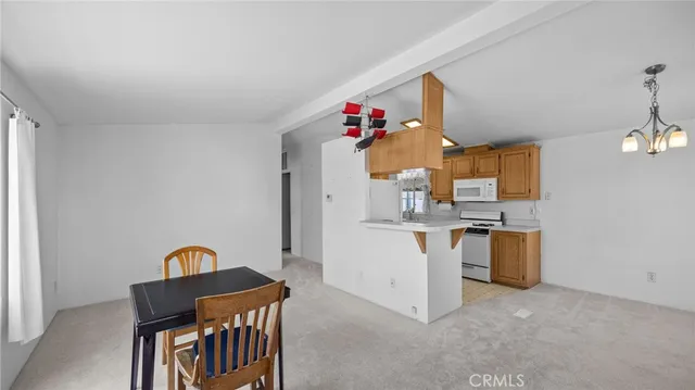 a view of a kitchen and utility room