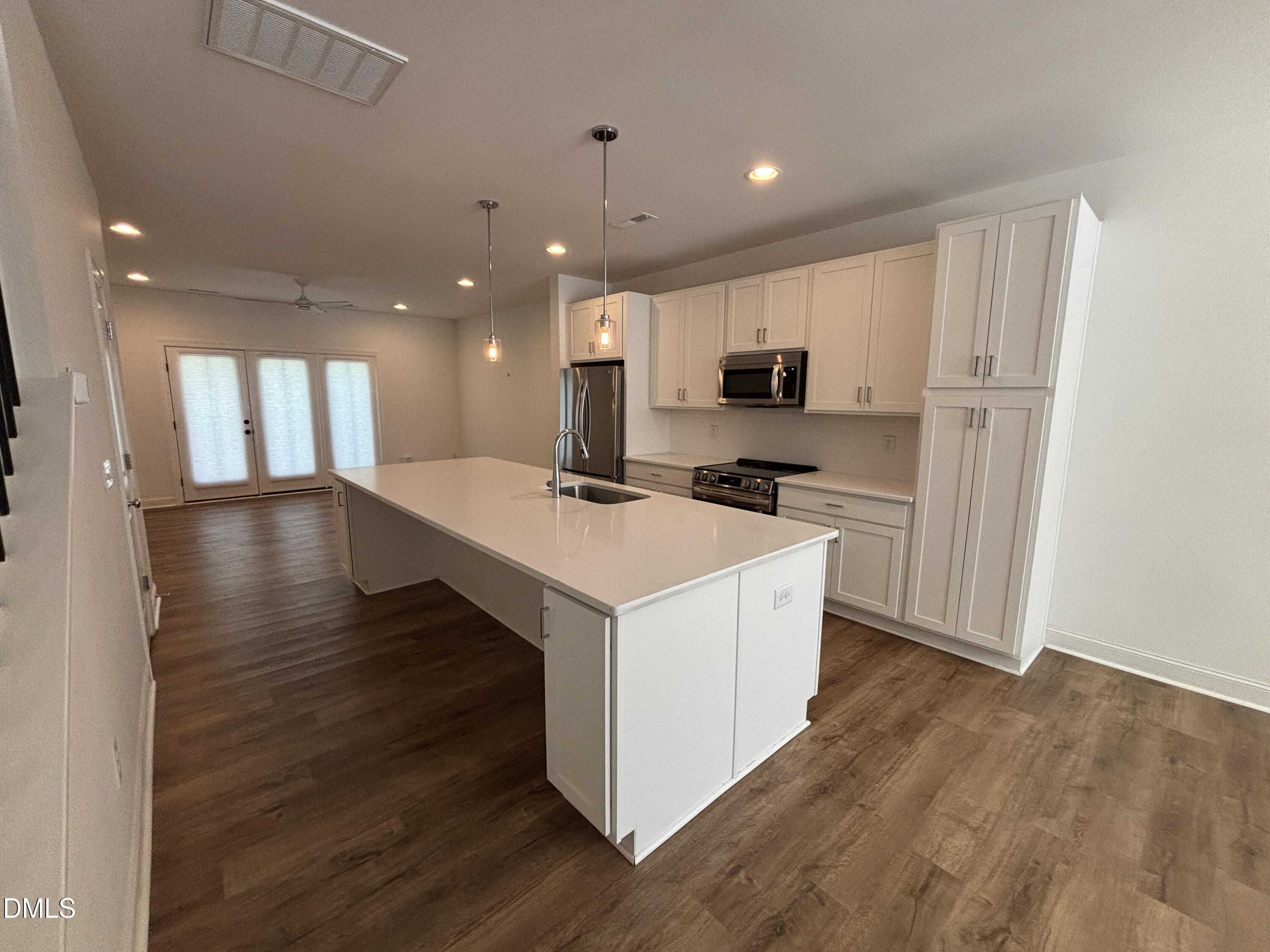 5710 Parker Pnes Court Raleigh, NC 27609 - Photo 13 of 78 a kitchen with stainless steel appliances granite countertop a sink stove and a refrigerator