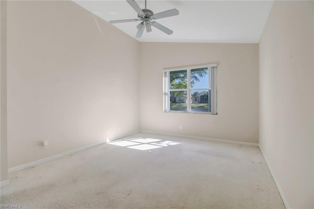 9373 Springview Loop Estero, FL 33928 - Photo 22 of 35 an empty room with windows and fan
