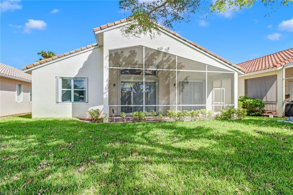 9373 Springview Loop Estero, FL 33928 - Photo 27 of 35 a view of a house with backyard and garden