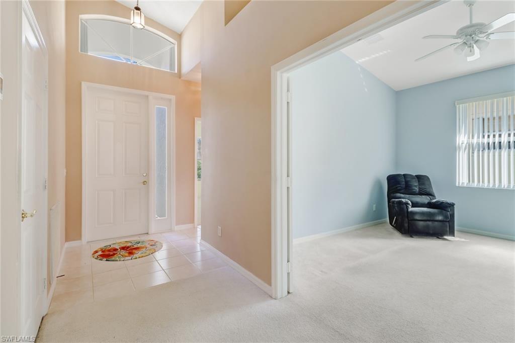 9373 Springview Loop Estero, FL 33928 - Photo 3 of 35 a view of an empty room and bedroom with windows