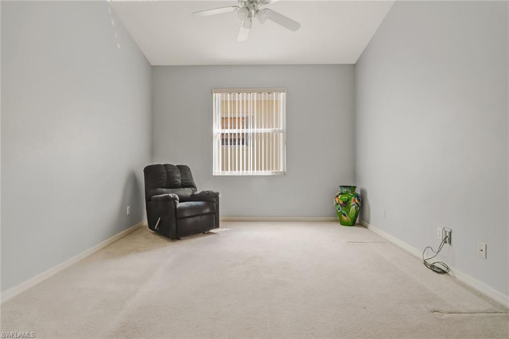 9373 Springview Loop Estero, FL 33928 - Photo 4 of 35 a living room with furniture and a window