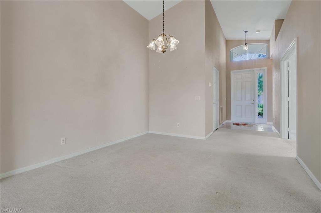 9373 Springview Loop Estero, FL 33928 - Photo 8 of 35 a view of a chandelier fan and refrigerator