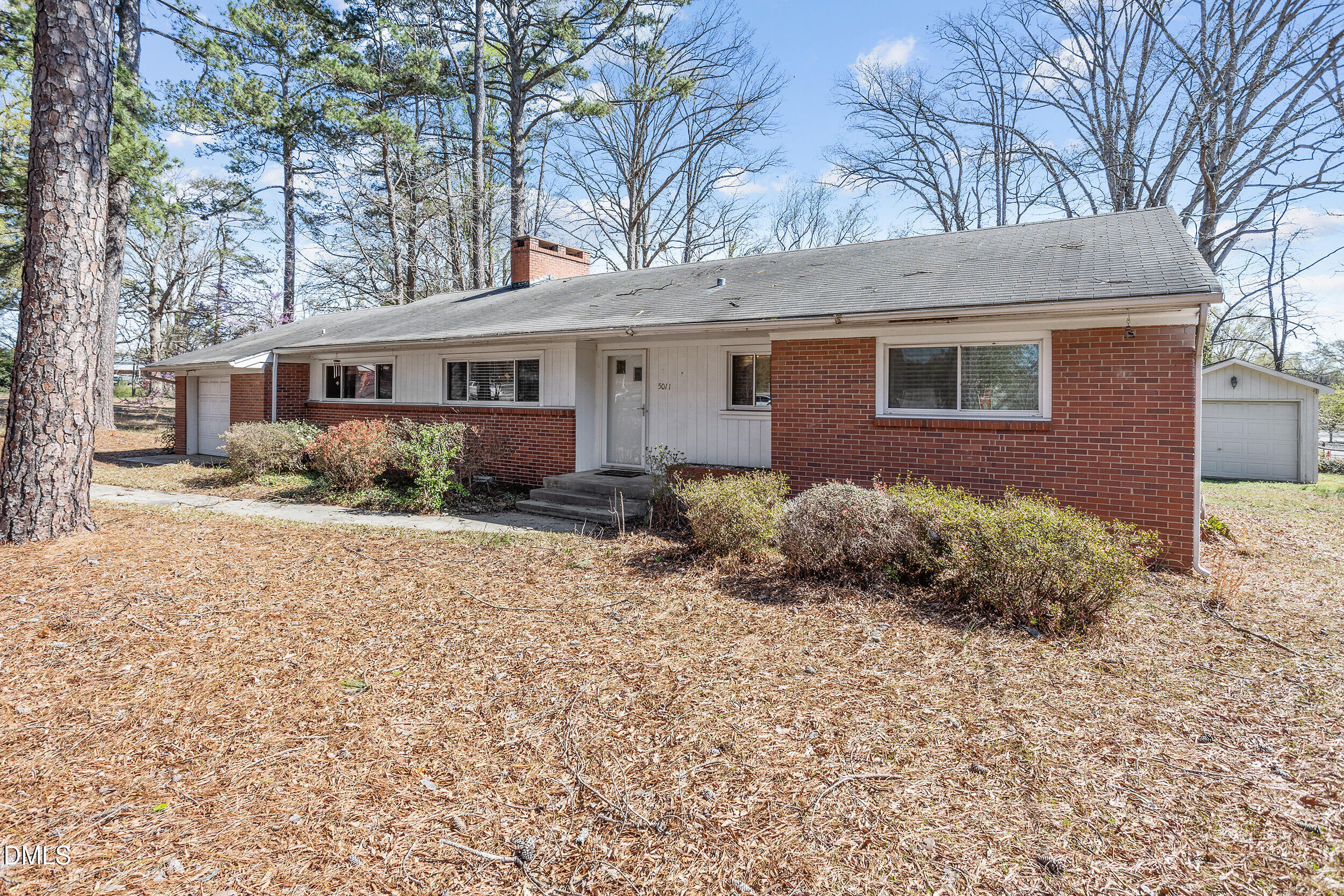 5011 Old Stage Road Raleigh, NC 27603 - Photo 5 of 29 a backyard of a house with potted plants and large tree