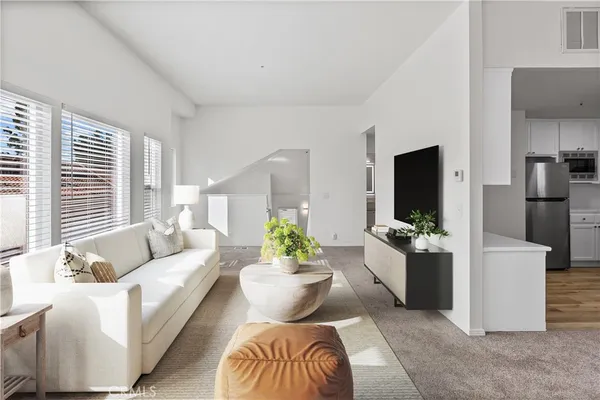a living room with furniture and a couch