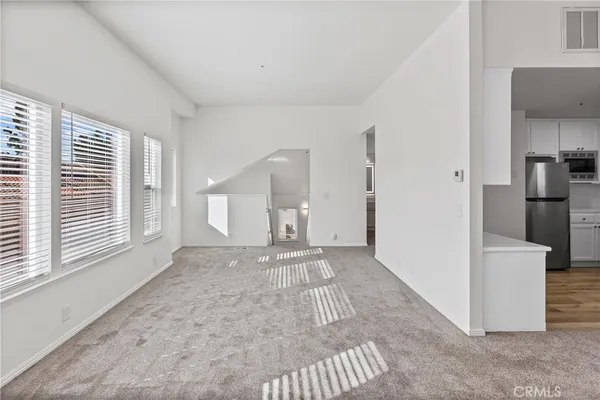 a view of a kitchen with a refrigerator a sink and a refrigerator