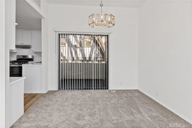 a view of a hallway with windows