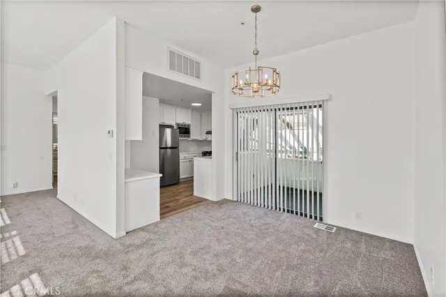 a kitchen with cabinets stainless steel appliances and a sink