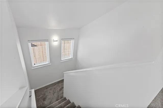 a view of room with window and hardwood floor