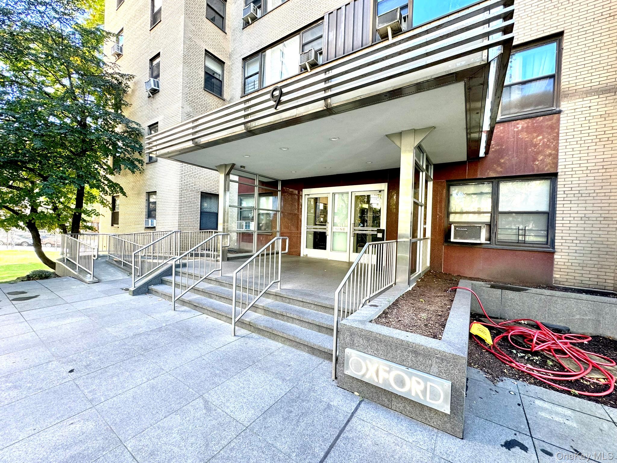 9 Fordham Hill Ovl, Unit 1H Bronx, NY 10468 - Photo 2 of 21 a view of a building with entryway