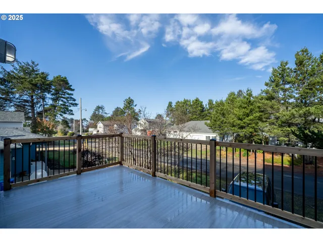 a view of a balcony with wooden fence