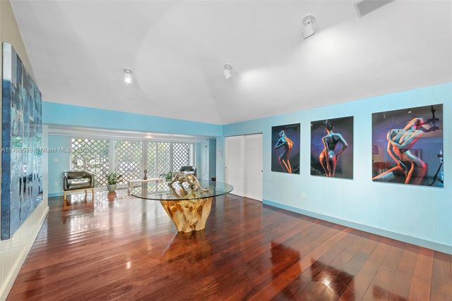 a view of a living room and dining room