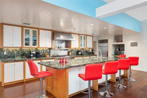 a view of kitchen with dining table and chairs