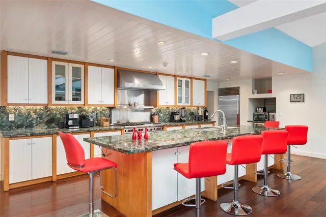 a view of kitchen with dining table and chairs
