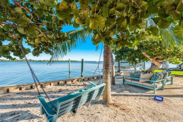 a view of a backyard with wooden fence
