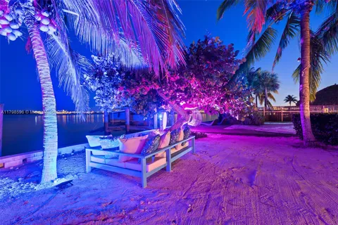 a view of a backyard with wooden fence