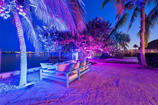 a view of a backyard with wooden fence