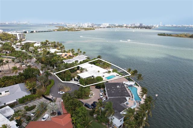 aerial view of a house with a lake view