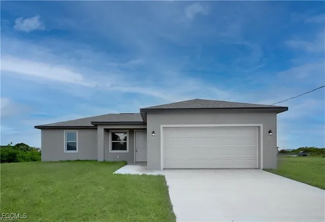 front view of a house with a yard